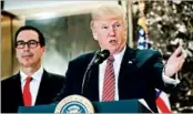  ?? PABLO MARTINEZ MONSIVAIS/AP ?? Treasury chief Steven Mnuchin, left, is defending President Trump’s response to the violence in Charlottes­ville, Va.