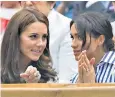  ?? ?? Kate, left, is seen as the ice queen who froze out Meghan over a lip gloss request