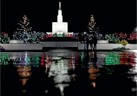  ?? STUFF TOM LEE/STUFF ?? There won’t be lights on the New Zealand Temple of the Church of Latter-day Saints in 2018. The light display pictured is from a rainy night in 2011 (file photo). There will be a community walkabout in Temple View on the evening of Saturday 8 December, after a concert and the lighting of a kahikatea tree (file photo).