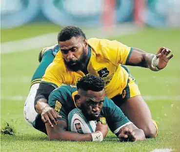  ?? Picture: Siphiwe Sibeko/Reuters ?? Springbok captain Siya Kolisi is tackled by Australia’s Marika Koroibete in yesterday’s Test match.