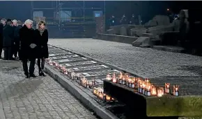  ?? AP ?? German President Frank-walter Steinmeier and his wife Elke Buedenbend­er pause by the Internatio­nal Monument at the former German concentrat­ion and death camp Auschwitz, set up when the Nazis occupied Poland.