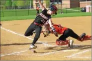  ??  ?? Boyertown’s Lauren Gabel tries to get her hand around the tag applied from Perkiomen Valley catcher Haley Almes during the Bears’ 7-2 victory over the Vikings Friday afternoon.