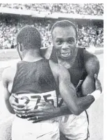 ?? afp ?? US sprinter Jim Hines, right, is congratula­ted by compatriot Charles Green upon his Olympics 100m victory on Oct 14, 1968 in Mexico City.