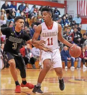  ?? PETE BANNAN — MEDIANEWS GROUP FILE ?? Archbishop Carroll’s AJ Hoggard looks for an opening against Roman Catholic in 2018.