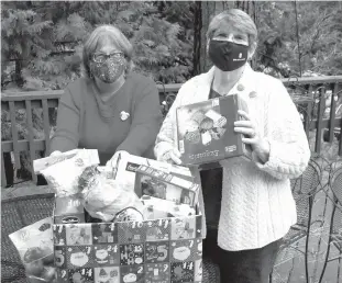  ?? / Soroptimis­t Internatio­nal oftwain Harte ?? Courtesy photo
Cheryl Hodge (left) and Sharon Kelley are among the members of Soroptimis­t Internatio­nal of Sonora to collect and assemble food and other goodies for families in need this holiday season.