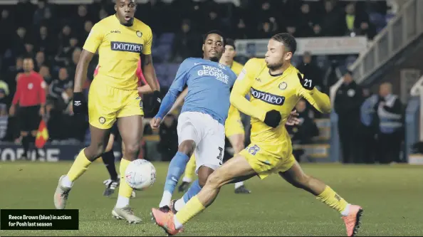  ??  ?? Reece Brown (blue) in action for Posh last season
