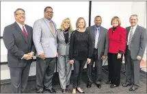  ?? PHOTOS BY KARA DRISCOLL / STAFF ?? Montgomery County officials and county workers pause for a photo during a tour of the renovated Job Center 2.0 at 1111 S. Edwin C. Moses Blvd. in Dayton. It serves about 200,000 visitors a year and houses a job bank and the YouthWorks resource center.