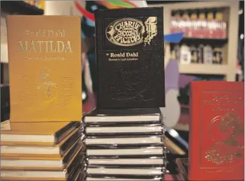  ?? AP PHOTO/ANDREW BURTON ?? Books by Roald Dahl are displayed at the Barney’s store on East 60th Street in New York in 2011.