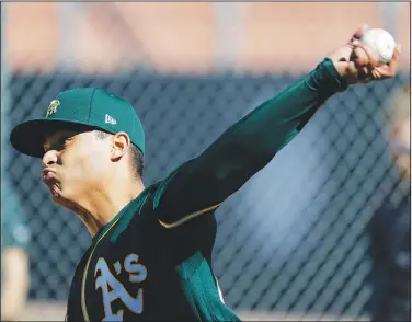  ?? (File photo/AP/Darron Cummings) ?? Oakland’s Jesus Luzardo throws the ball Feb. 13 during spring training baseball practice in Mesa, Ariz.