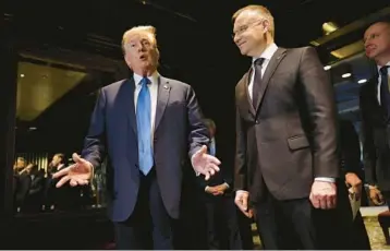  ?? MICHAEL M. SANTIAGO/GETTY ?? Former President Donald Trump meets with Poland’s President Andrzej Duda on Thursday at Trump Tower in New York City. Duda, a robust supporter of Ukraine, met with Trump to talk about NATO and Russia’s invasion.