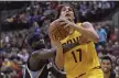  ?? JAY LAPRETE — THE ASSOCIATED PRESS ?? The Grizzlies’ Zach Randolph, left, fouls Anderson Varejao during the first quarter of a 2015presea­son game in Columbus.