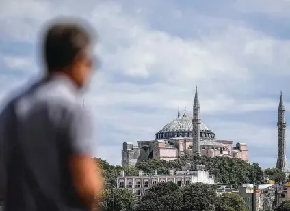  ?? Ozan Kose / AFP via Getty Images ?? Hagia Sophia rises majestical­ly above Istanbul. Originally a Christian cathedral, it was a mosque from 1454 until 1934, when it became a museum. Beginning July 24, it will revert to being a mosque, with its Christian images concealed during prayer times.
