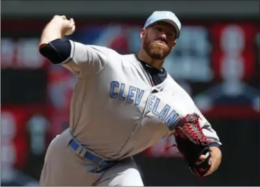  ?? JIM MONE — THE ASSOCIATED PRESS ?? Indians relief pitcher Zach McAllister throws against the Twins in the fifth inning of the first game.