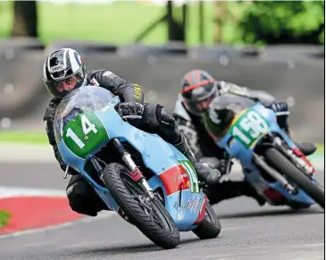  ??  ?? Above: Seventeen-year-oldtomwood­ward, who made a big impression on an MT-125 Honda at Donington in 2019, was back out here on dad Symon’s, RD250, enjoying two great battles with the similarly mounted Andy Green (14). Green it was who edged out Woodward by inches in both races but there’s no doubt that the youngster has a potentiall­y strong future in the sport.