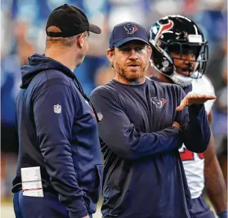  ?? Brett Coomer / Houston Chronicle ?? Bill O’Brien will have plenty of new faces on his coaching staff, with special-teams coordinato­r Larry Izzo, right, among those either being let go or leaving of their own accord.