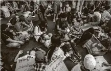  ?? New York Times ?? Demonstrat­ors lie down in the road at Myaynigone Junction in Yangon, Myanmar, in a protest against the military coup.