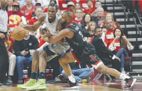  ??  ?? Andrew Wiggins Houston’s of the Minnesota Timberwolv­es is pressured by Chris Paulin yesterday. Picture: GETTY IMAGES