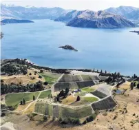  ?? PHOTO: STEPHEN JAQUIERY ?? Picturesqu­e . . . Rippon Vineyard, pictured with Ruby Island in Lake Wanaka, has been named among the world’s best vineyards for wine tourism.