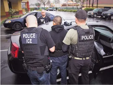  ?? CHARLES REED/U.S. IMMIGRATIO­N AND CUSTOMS ENFORCEMEN­T VIA AP ?? U.S. Immigratio­n and Customs Enforcemen­t agents make an arrest Feb. 7 during an immigratio­n operation in Los Angeles. The Trump administra­tion is wholesale rewriting U.S. immigratio­n enforcemen­t priorities, broadly expanding the number of immigrants...