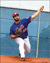  ?? File Photo / The Associated Press ?? Josh Smoker throws in the bullpen for the Mets during Spring Training in March.