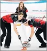  ?? AP PHOTO/NATACHA PISARENKO ?? Canada’s skip Rachel Homan, centre, watches teammates Lisa Weagle, left, and Joanne Courtney sweep the ice during a women’s curling match against China at the 2018 Winter Olympics in Gangneung, South Korea, Tuesday.