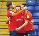  ??  ?? DELIGHT: The Hatters celebrate Dan Potts’ winner