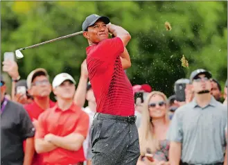  ?? MIKE CARLSON/AP PHOTO ?? Tiger Woods tees off on the 15th hole during the final round of the Valspar Championsh­ip on Sunday at Palm Harbor, Fla. He finished in a two-way tie for second place.