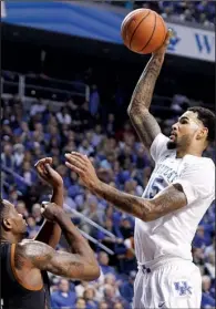  ?? AP/JAMES CRISP ?? (right) shoots over Prince Ibeh of Texas for two of his game-high 21 points to lead the top-ranked Wildcats to a 63-51 victory over the No. 6 Longhorns on Friday at Rupp Arena in Lexington, Ky.