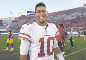  ?? Mark J. Terrill / Associated Press ?? Undefeated starting quarterbac­k Jimmy Garoppolo has a smile that could sell in Hollywood. It’s a good thing the 49ers don’t have to compete with Hollywood’s money to keep him.