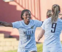  ?? MIKE MANTUCCA/DAILY SOUTHTOWN ?? Metea Valley’s Tyra King, left, celebrates with teammates after scoring a goal against LincolnWay Central during a Class 3A state semifinal at North Central College in Naperville on Friday.