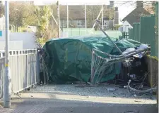  ??  ?? The wreckage of the car in which Danny Barnes (top) died is covered by a tarpaulin. Photo: Mary Browne