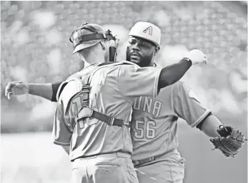  ?? ERIC HARTLINE, USA TODAY SPORTS ?? Catcher Chris Herrmann and closer Fernando Rodney celebrate after the Diamondbac­ks beat the Phillies on Sunday, with Rodney recording his 20th save of the season.