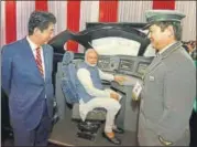  ?? PTI ?? PM Narendra Modi with Shinzo Abe during their visit to an exhibition at Mahatma Mandir in Gandhinaga­r on Thursday.