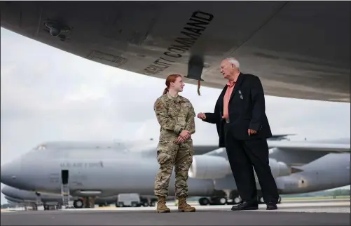  ??  ?? Sparks talks with Airman 1st Class Cydney Lee (left) on June 21 while under a C-5M Super Galaxy aircraft on the flightline at Dover Air Force Base, Del. The C-5M Super Galaxy is one of the aircraft used for dignified transfer of remains, conducted upon arrival at Dover Air Force Base to honor those who have died while serving in a military theater of operations.