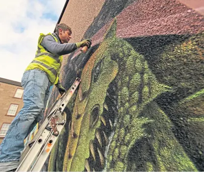  ??  ?? Paco Graff’s mural taking shape on the Lyon Street building after his first work was vandalised.