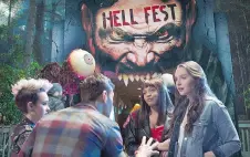  ?? CBS FILMS/LIONSGATE ?? Bex Taylor-Klaus, left, Reign Edwards, Amy Forsyth and Christian James (back to the camera) are featured in Hell Fest, a film that aims to be hor- rific but ends up being very pedestrian.