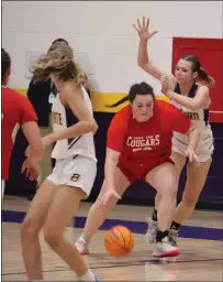  ?? ?? Upper Lake's Taylar Minnis puts the ball on the floor in an attempt to get around a Bret Harte defender.