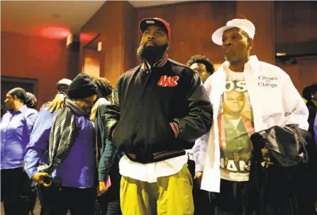  ?? David Carson / Associated Press ?? Michael Brown’s father, Mike Brown Sr. ( enter), listens at a City Council meeting about a deal with the U. S. Justice Department.