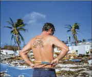  ?? LOREN ELLIOTT / TAMPA BAY TIMES ?? Bill Quinn views the foundation Tuesday where his mobile home was at the Seabreeze Trailer Park in the Florida Keys town of Islamorada.