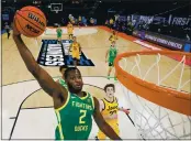  ?? SARAH STIER — GETTY IMAGES ?? Oregon’s Eugene Omoruyi drives to the basket against Iowa in a second-round game of the NCAA Tournament at Bankers Life Fieldhouse in Indianapol­is on Monday.