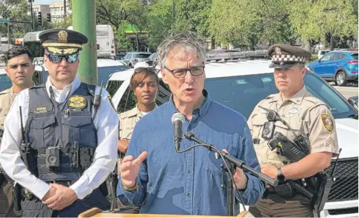  ?? PATRICK SMITH/WBEZ ?? Cook County Sheriff Tom Dart speaks near 71st Street and Vincennes Avenue on May 23.