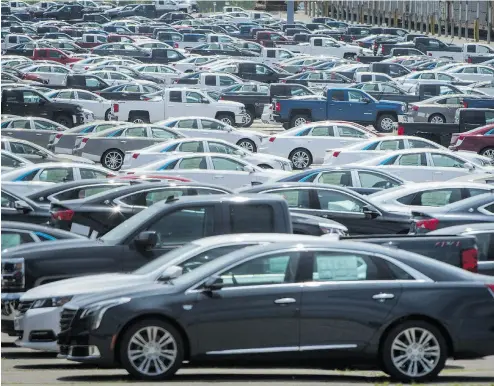  ?? TIJANA MARTIN / THE CANADIAN PRESS FILES ?? Industry experts in Canada say the imposition of tariffs by the U.S. on Canadian-made vehicles like these at the GM assembly plant in Oshawa would have disastrous effects on the industry here.