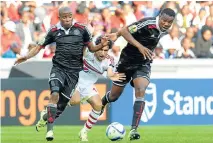  ?? Picture: BACKPAGEPI­X ?? MIDDLE MAN: Alhy Hefny of Zamalek is boxed in by Thabo Matlaba, left, and Thamsanqa Gabuza of Orlando Pirates during yesterday’s Caf Confederat­ion Cup match at Mbombela Stadium