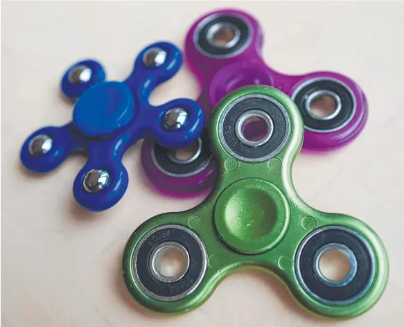  ??  ?? This has been the year of the fidget spinner, with the ubiquitous toy turning up everywhere to the pleasure of many and the annoyance of others.