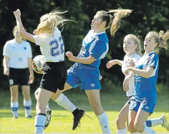  ?? CLIFFORD SKARSTEDT EXAMINER ?? Peterborou­gh City Blue's Catie Dobson moves in on Darlington Energy's Grace Bandel during Peterborou­gh City Soccer Associatio­n Girls' Challenge Cup Tournament action on Saturday at Beavermead Park.