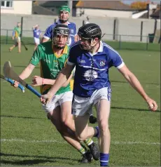  ??  ?? Aidan Murphy of Oylegate-Glenbrien on the ball as Paddy Barron (Rathgarogu­e-Cushinstow­n) closes him down.