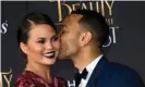  ?? Photograph: Valerie Macon/AFP/Getty Images ?? Chrissy Teigen with her husband in 2017. Teigen tweeted of Trump: ‘Lol, what a pussy ass bitch. Tagged everyone but me. An honor, Mr President.’