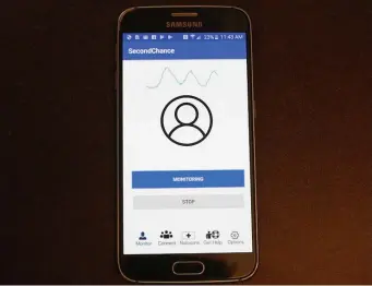 ?? AP ?? DISTRESS CALL: This image from video provided by the University of Washington shows a demonstrat­ion of the smartphone app that uses sound waves to measure breathing. In first-step testing, the device detected early breathing problems in people who’d just injected illegal drugs.