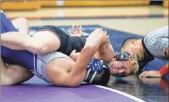  ?? Keith Deal ?? Lafayette’s Karson Ledford gets a pin during the Ramblers’ match at Coahulla Creek last week.