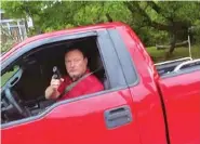  ?? PHOTO CONTRIBUTE­D BY ADRIENNE COOPER ?? This man pointed his gun at Adrienne Cooper after she took photos of his license plate following an alleged road rage incident Tuesday night. Police later arrested Terry Nations.